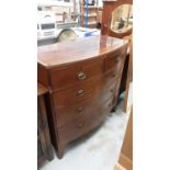 Nineteenth century mahogany bowfront chest of two short and three long graduated drawers with crossb
