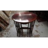 Edwardian inlaid mahogany nest of four oval tables