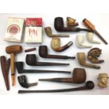 Collection of old pipes and two packets of cigarettes within a Cuban cigar box