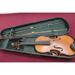 Antique violin with two bows in wooden case