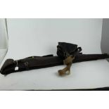 Good quality leather gun slip by John Shooter, together with a cartridge bag (2)