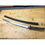 Japanese Katana with iron tsuba and curved steel blade, 63cm in length. 85cm in overall length.