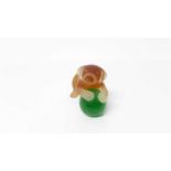 Daum Pate de Verre amber glass model of a dog with green glass ball, signed, 5.5cm high
