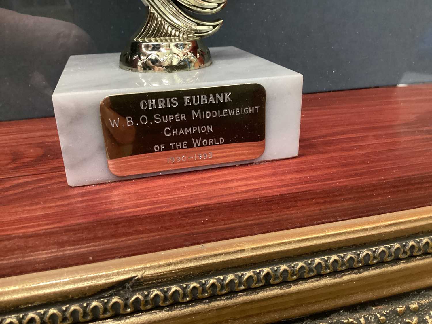 Chris Eubank signed boxing gloves, trophy etc in glazed frame - Image 7 of 8