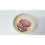 Moorcroft pottery bowl decorated with pink flowers on cream ground