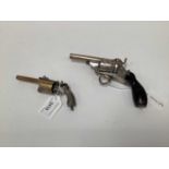 Two late 19th century French novelty sewing accessories in the form of pistols