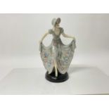 Stefan Dakon for Goldscheider a 1930's Art Deco figure of a lady in pretty dress, impressed and prin