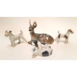 Three Royal Copenhagen dogs numbered 453, 2072 and 1452, together with a Copenhagen stag (4)
