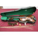 Antique violin with bow in case