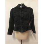 Victorian jacket with nipped waist, flared peplum, trim with black braid. A Victorian black under-b
