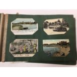 Green postcard album including early and vignette cards, glamour, topography, french cards and other