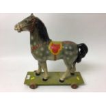old painted child's horse on wheels