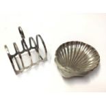 Silver toast rack together with a silver shell butter dish
