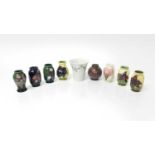 Eight Moorcroft miniature vases, various patterns, together with a Moorcroft Macintyre vase