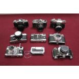 Group of cameras and lenses, including Edixa, Exakta, Zeiss, Voigtlander, etc, in two hard cases
