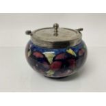 Moorcroft pottery biscuit barrel decorated in the pansy pattern with plated lid, impressed marks and
