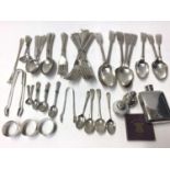 Three Georgian fiddle pattern table spoons, together silver napkin rings, other silver flatware and