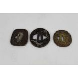 Japanese bronze tsuba with pierced decoration depicting Tigers, together with two other bronze tsuba