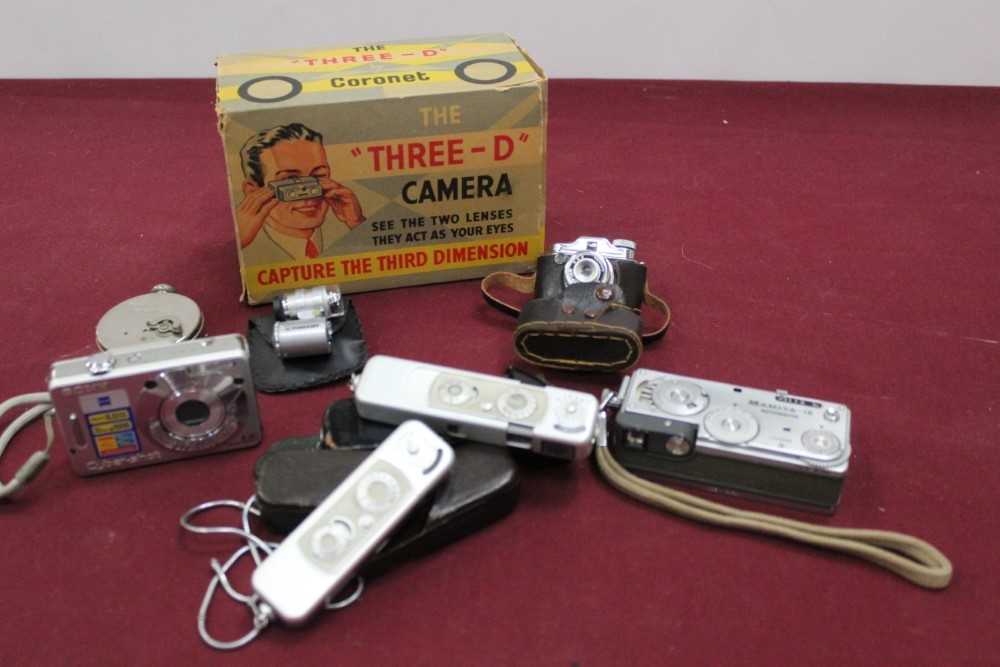 Group of cameras, including a Boxed Coronet Three-D with multi-coloured finish, a Ticka pocket camer