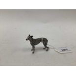 Cold painted bronze model of a greyhound, signed with the mark for Frank Bergmann, 5.5cm high