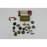 First World War Princess Mary Gift Tin, together with RAF, Royal Engineers, and other cap badges tog