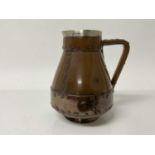 Doulton Lambeth Silicon ware jug, made to resemble a copper riveted jack, with silver rim, impressed