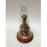 Franz Hermle brass skeleton clock, with conical glass dial and key