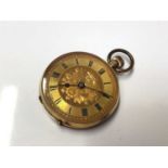 Late 19th century Continental 9k gold fob watch in engraved case, 3.4cm in diameter
