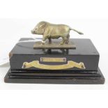 1940's Indian Army trophy depicting a Boar mounted on an ebonised wood base with applied plaques