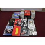 Three boxes of music related DVD's, video's and books etc, including The Beatles, John Peel, Mick Fa