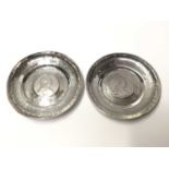 Two Continental silver dishes mounted with coins