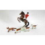 Beswick Huntsman on rearing horse, model no 868, together with a Beswick for and three hounds