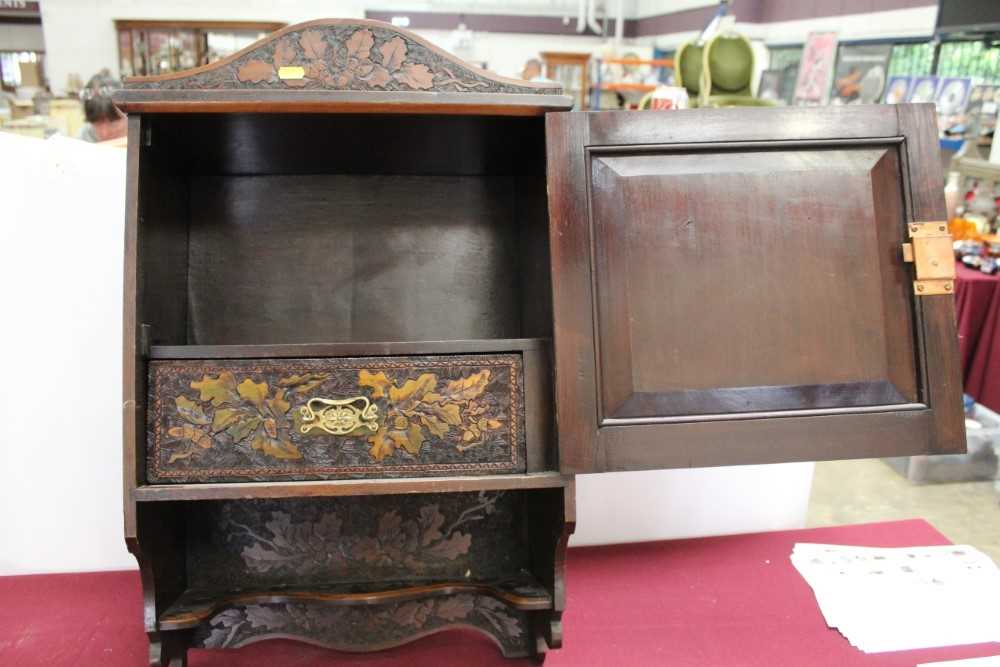 Black Forest type caved hanging cabinet, with figures, foliage and a stag, 61cm high x 44cm across - Image 2 of 3