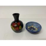 Small Moorcroft pottery vase with floral decoration, 9cm high, together with a small Moorcroft bowl,