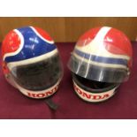 Three boxes of Arai and Honda branded motorcycle helmets