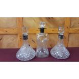 Three silver mounted glass decanters