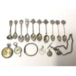 Collection of silver and plated military related teaspoons, WWII pocket watch, chain, silver fobs et