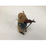 Schuco clockwork model of a pig playing the violin, together with a German clockwork rabbit (2)