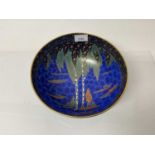 Carlton ware lustre bowl decorated with trees on blue ground, 23cm diameter