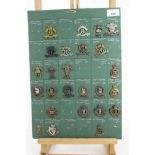 Five boards mounted with British military cap badges, Lancers, Hussars and Dragoons some reproductio