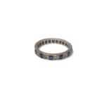 Diamond and synthetic sapphire eternity ring in white gold setting
