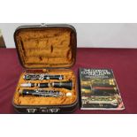 Corton clarinet in case, together with a lesson book