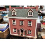Dolls house containing furniture