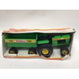 Three boxed Tobnka Toys, Japanese Battery Operated Tractor and Ertl Toys Are Us Lorry.