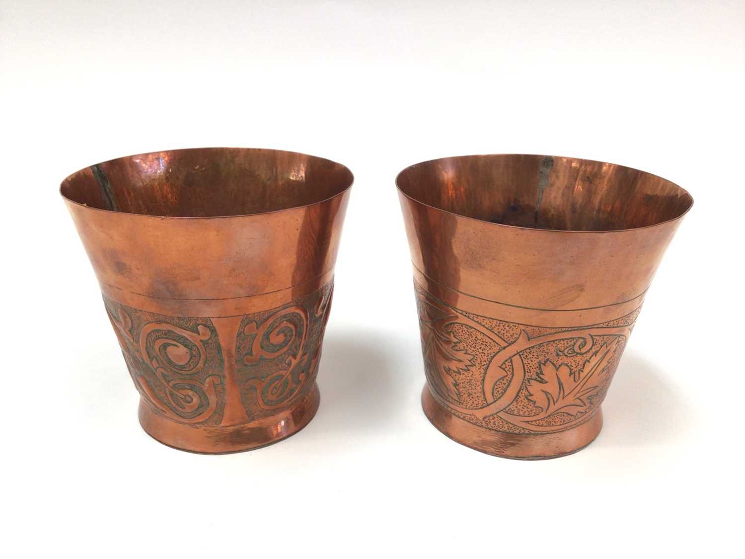 Pair of Arts & Crafts copper beakers by Keswick School of Industrial Arts