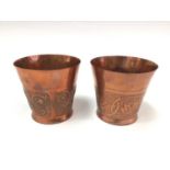 Pair of Arts & Crafts copper beakers by Keswick School of Industrial Arts