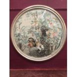 Large circular Chinese embroidered silk panel depicting cockrel and chicken in rocky landscape with