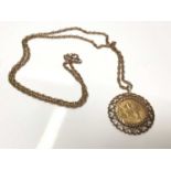 George V gold half sovereign, 1926, in 9ct gold pendant mount on 9ct gold chain