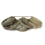 Ten green jade/ hard stone polished bangles