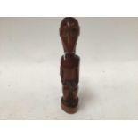 African red ivory wood figure of a seated monkey, in the style of the Baboon Master of Southern Afri